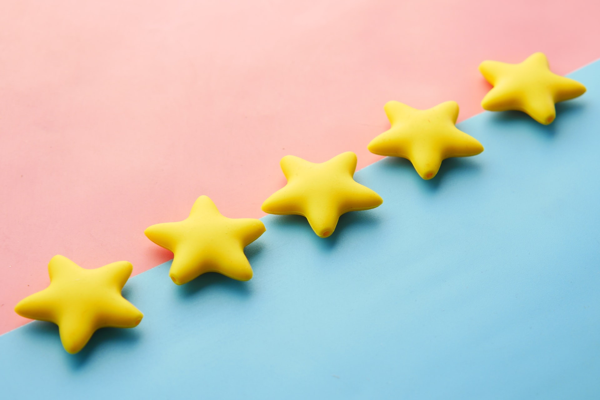 how to get more google reviews - 5 stars laid on pink and blue background