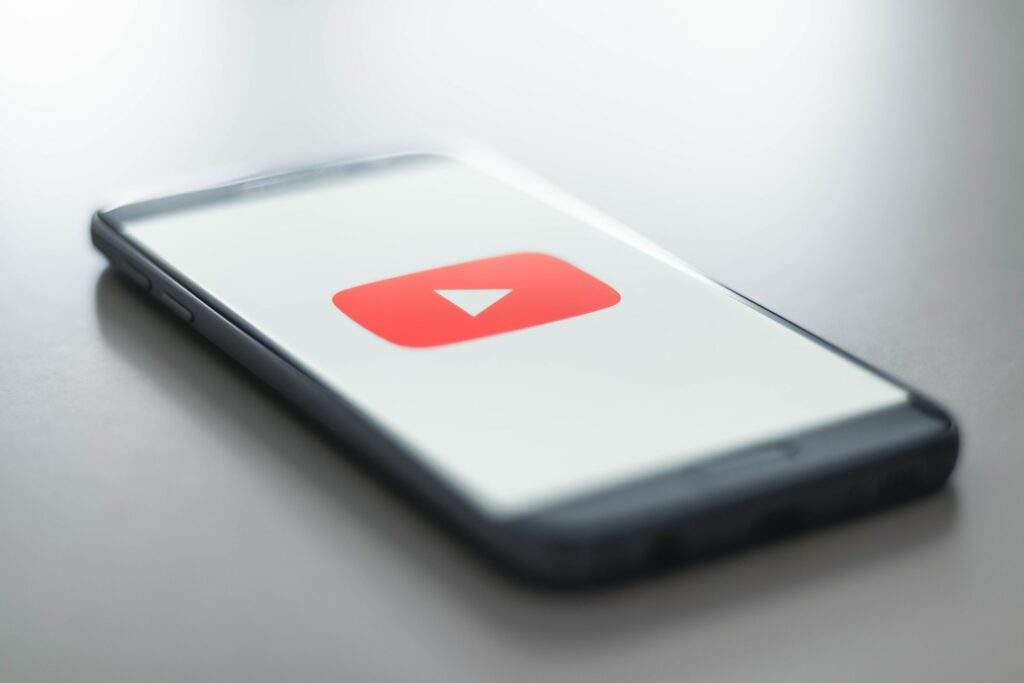 smartphone with youtube logo on screen