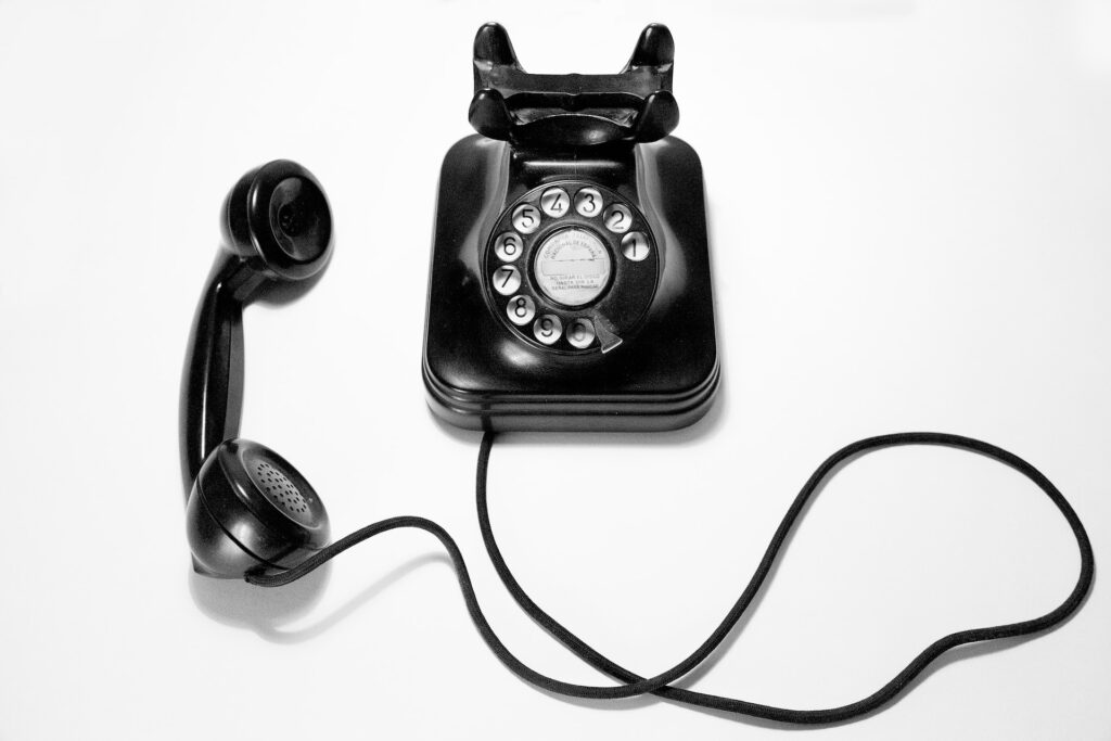 black vintage phone on a white background