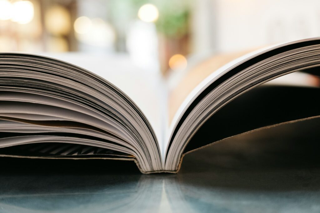 side view of book spread open down middle