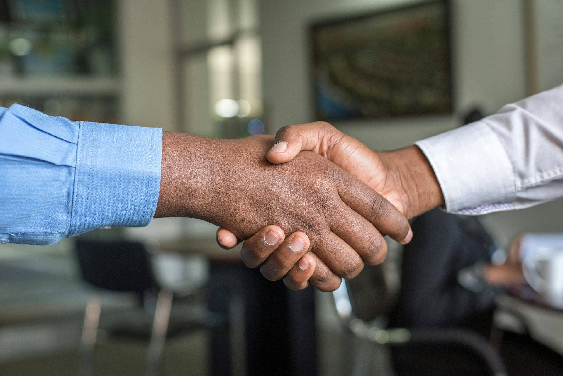 Two people shaking hands on their small business collaboration.